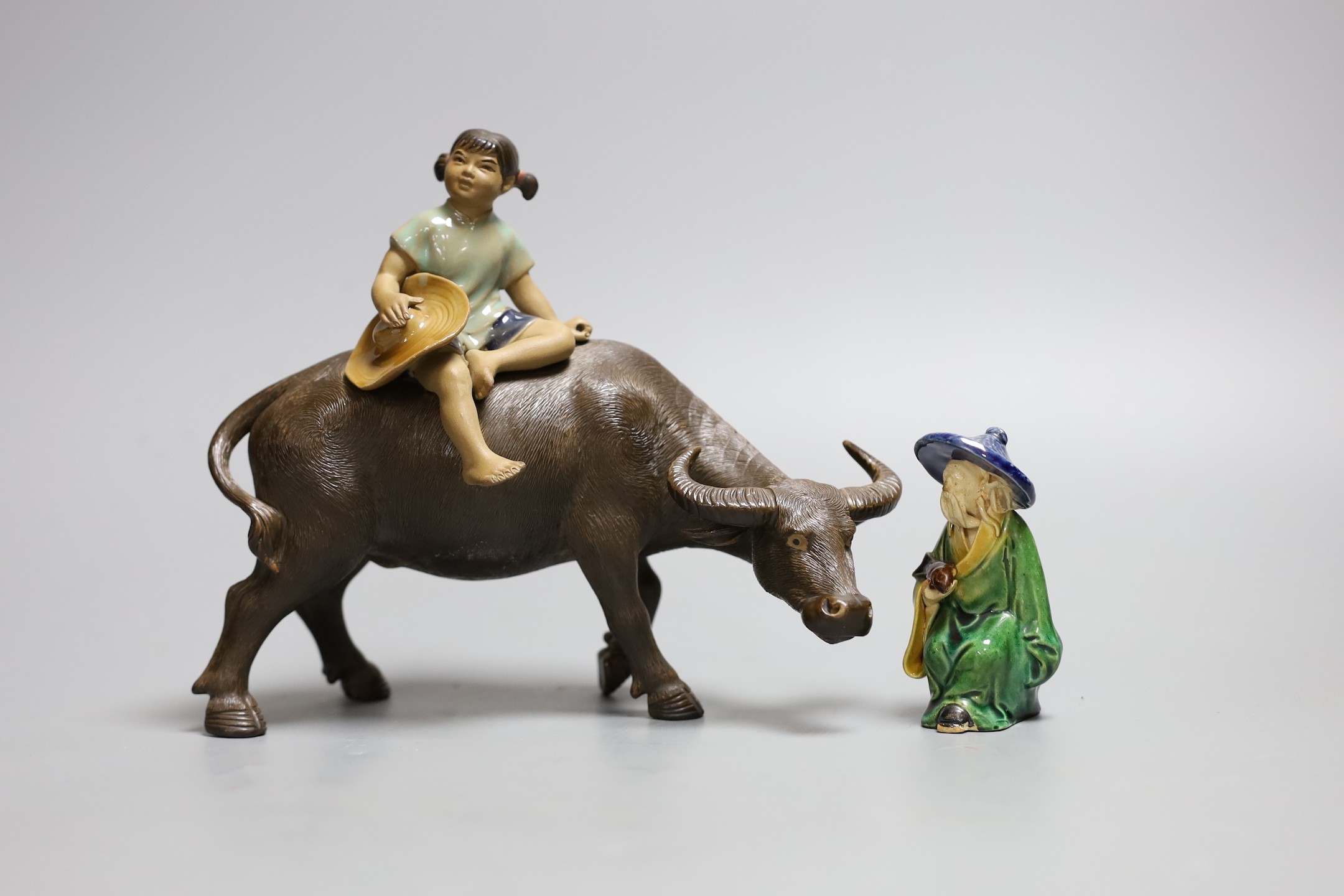 A Chinese Shiwan group of a girl on a buffalo and another, Girl on buffalo 20cms wide
